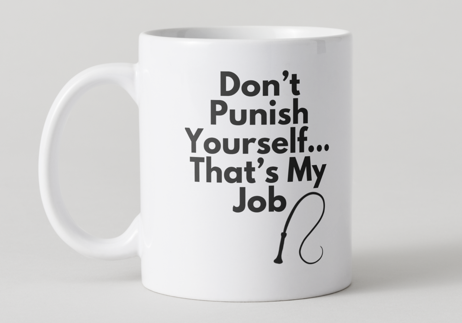 White mug with humorous text "Don't Punish Yourself... That's my job" and a cane graphic on a light gray background