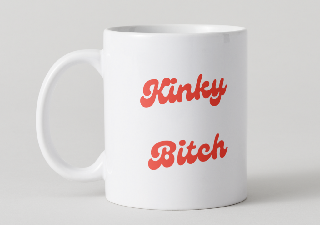 White mug with red text 'Kinky Bitch' on a light gray background
