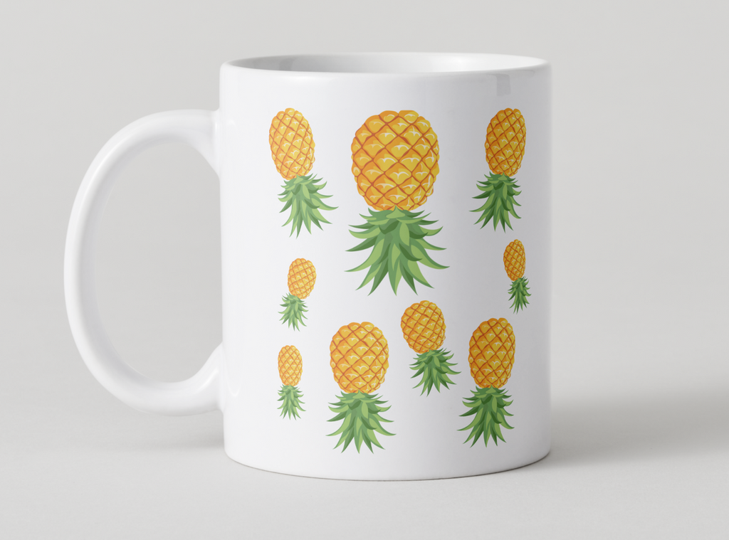 White mug with an upside down pineapple design on a light gray background